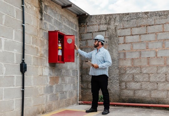 Man controls fire cabinet.