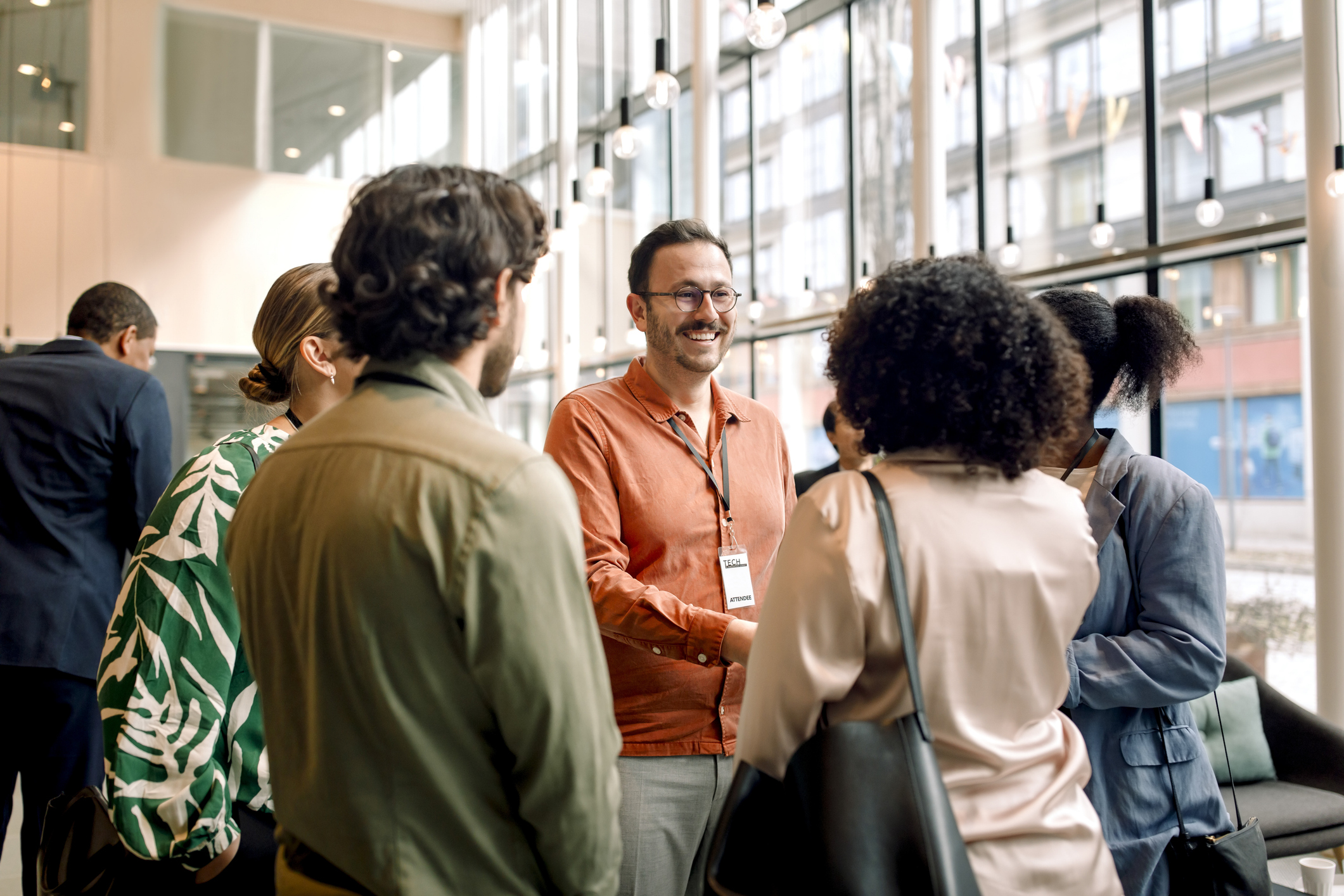 Two people greeting each other at a networking conference