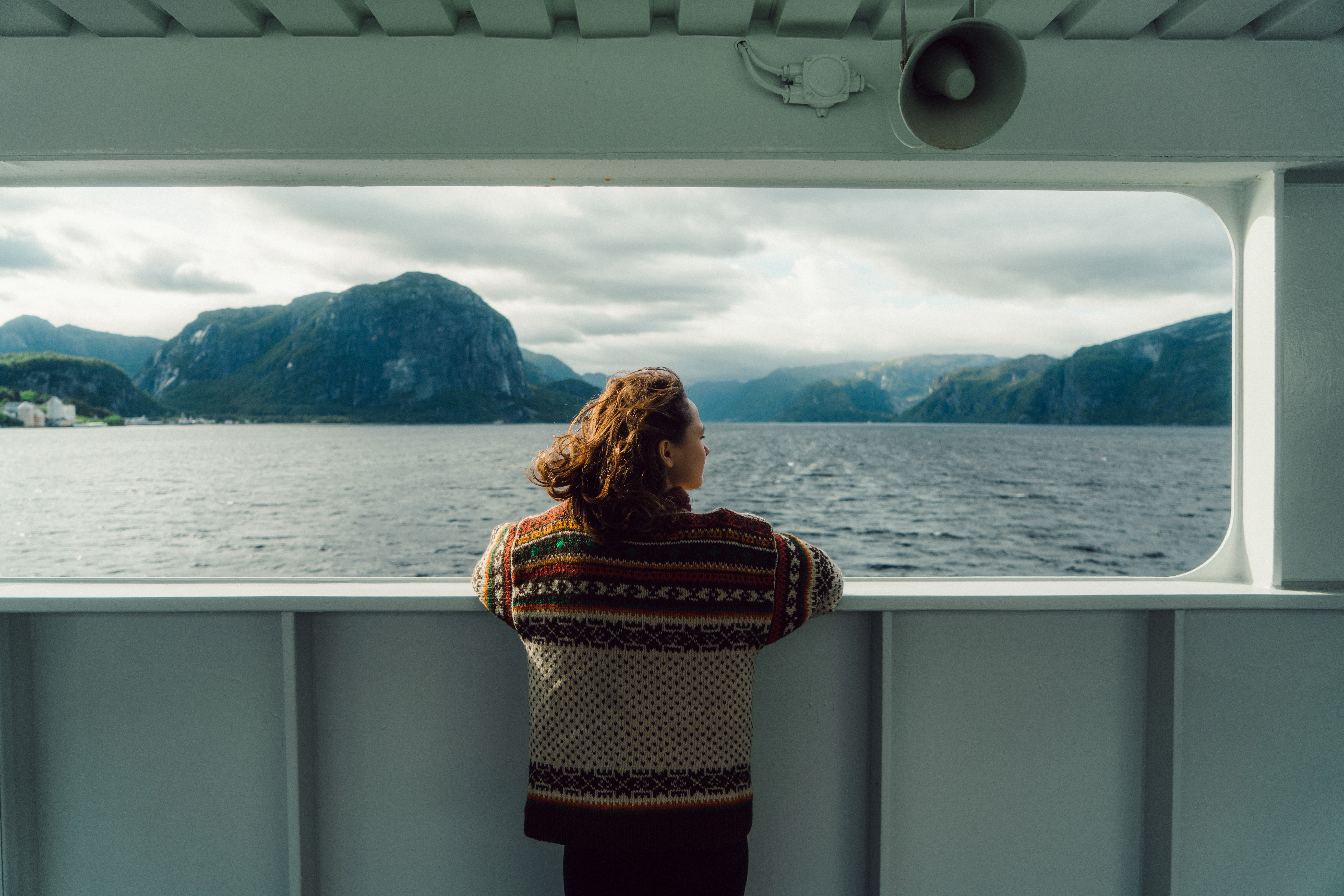 Woman standing on a ferry and looking out