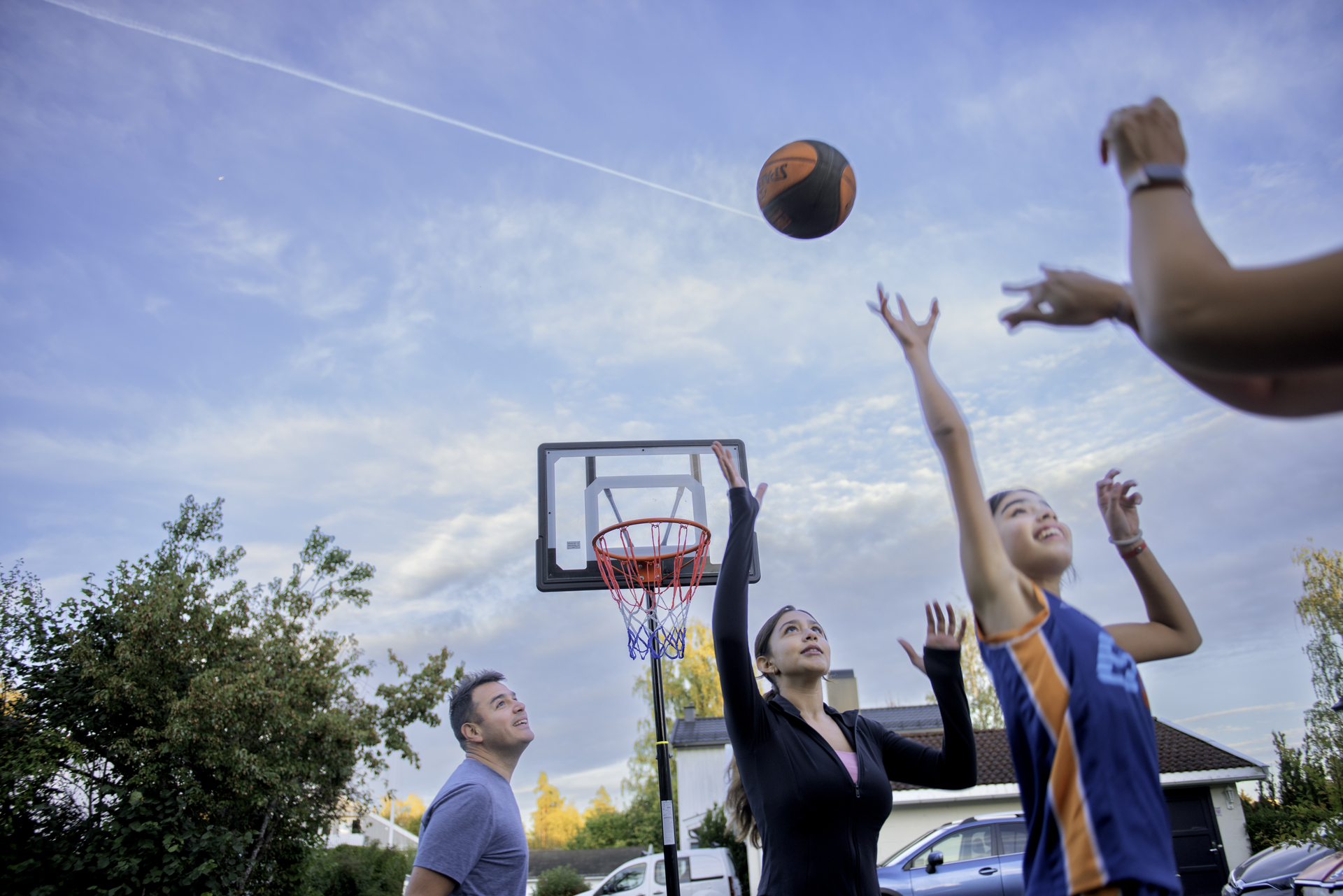 Young people play basketball