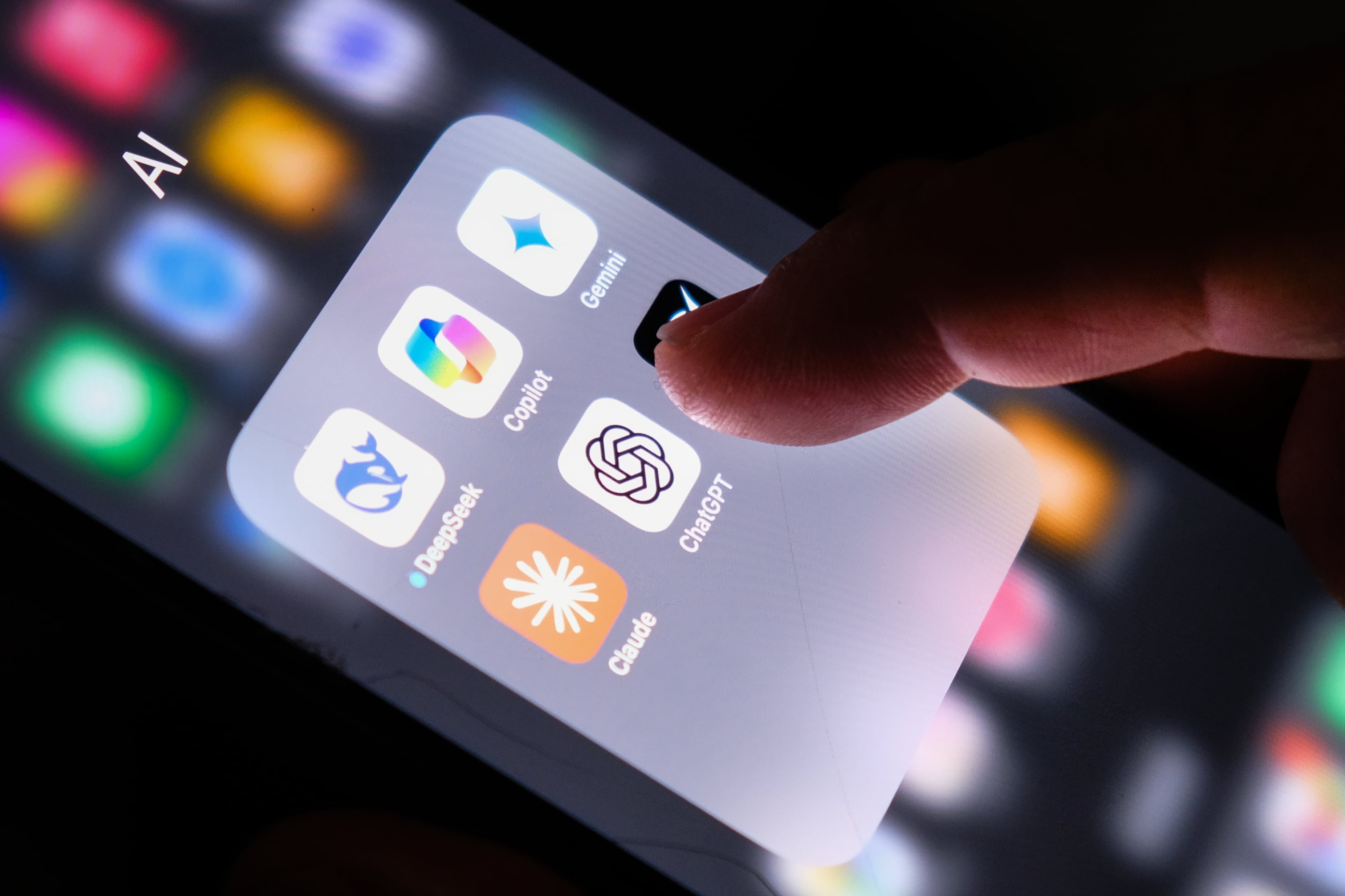 A mobile phone showing icons for various AI chatbots