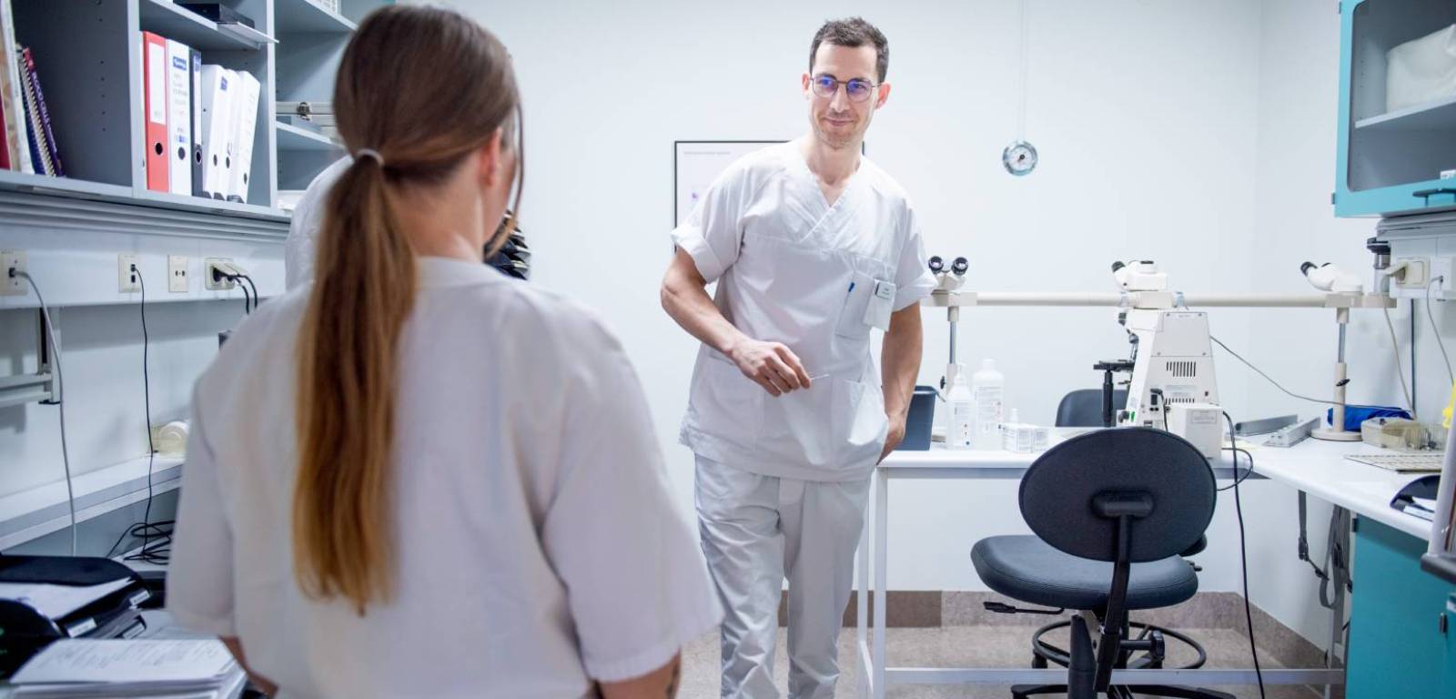 Two bioengineers inside a laboratory room.