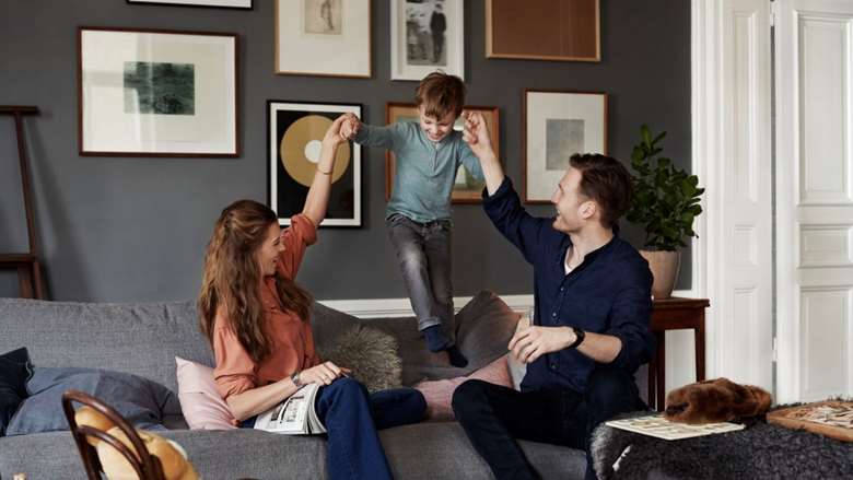 Powerpoint_16_9-Family playing on couch.jpg