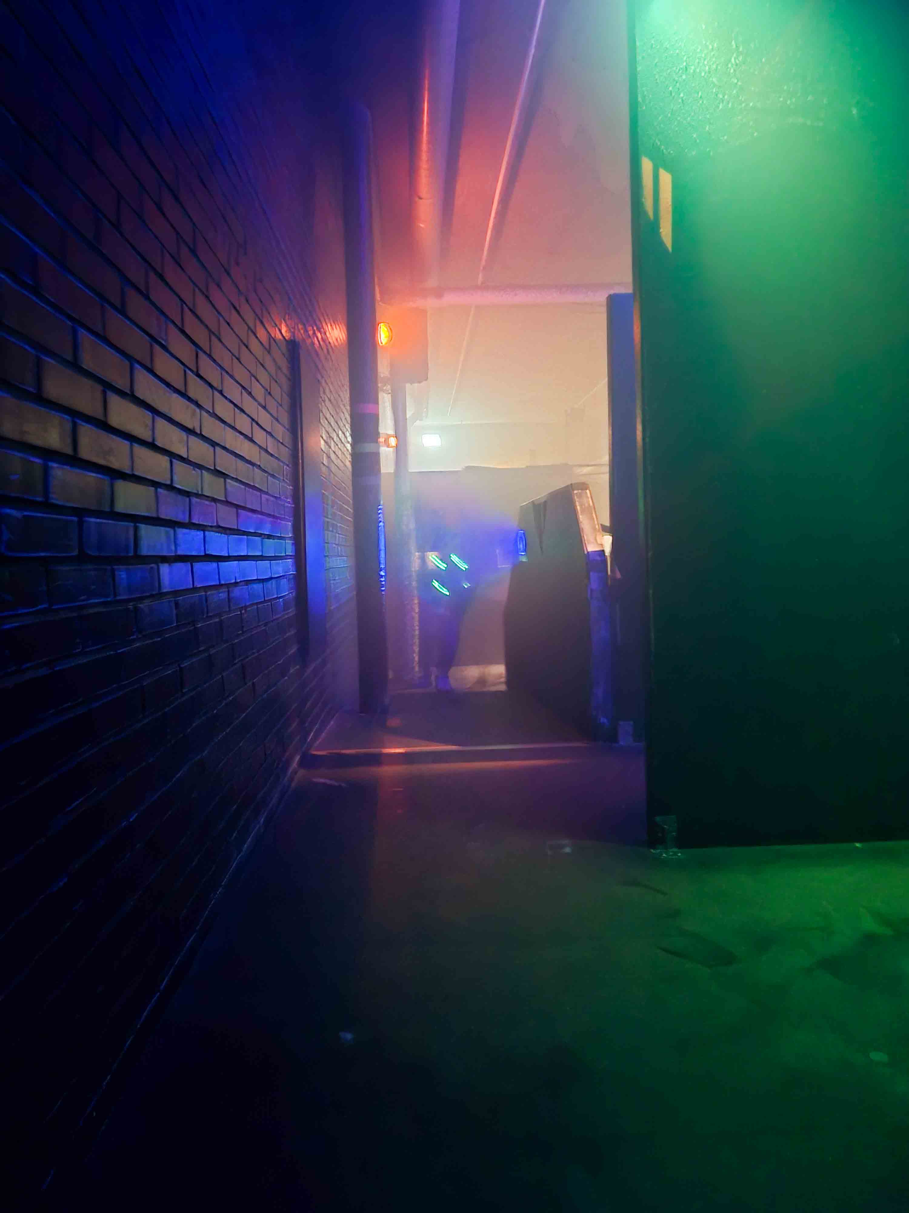 Colorful laser against concrete wall. Photo: Mari Ødegaard