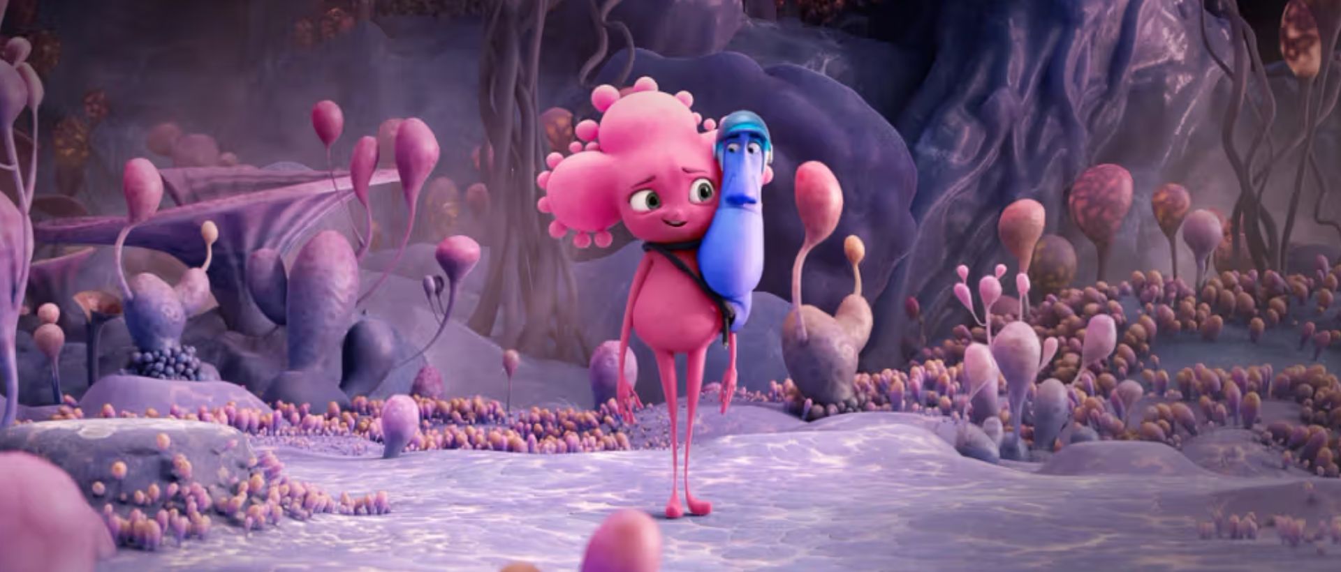 Menneskeliknende celle som smiler. Bilde fra Filmweb.no