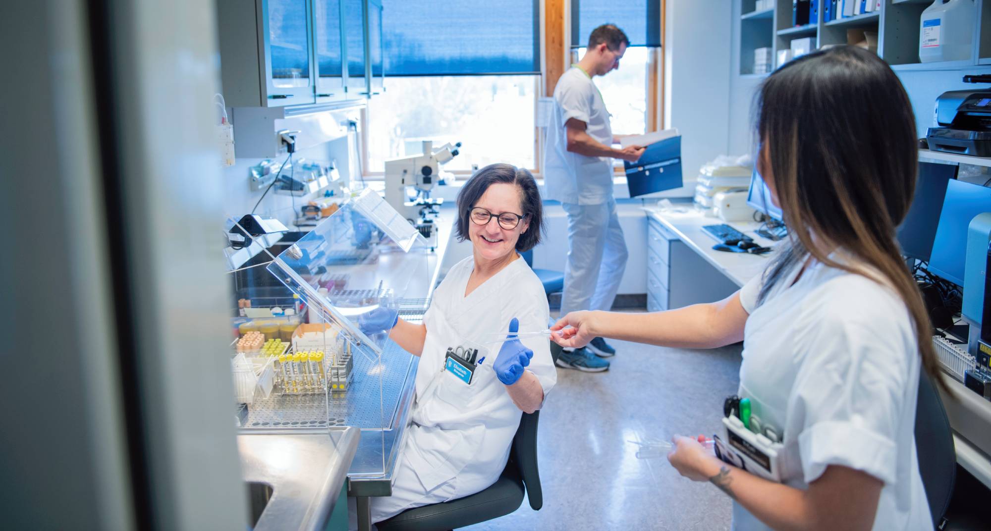 A group of bioengineers inside a laboratory room.