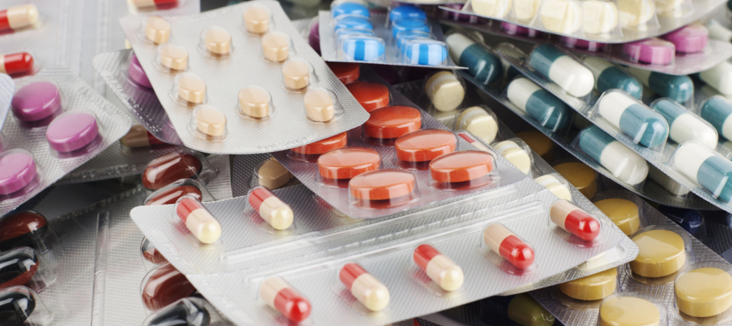 Many trays of antibiotics lying across a table