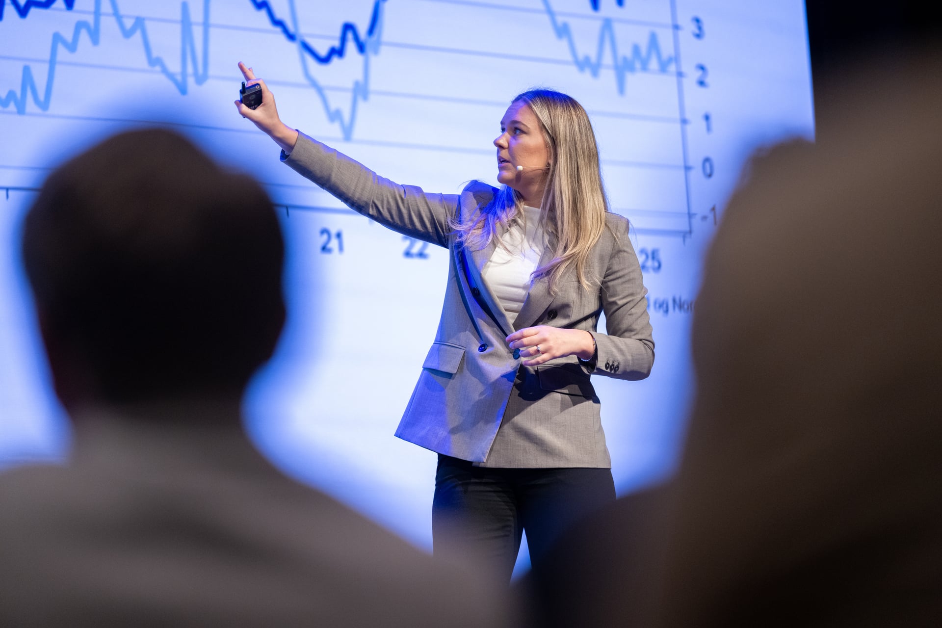 Woman points and shows salary statistics