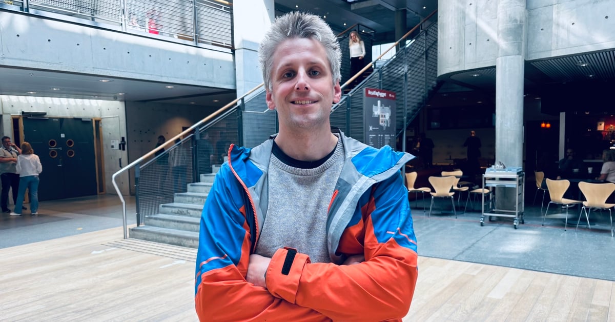 Image of smiling man with gray hair and all-weather jacket